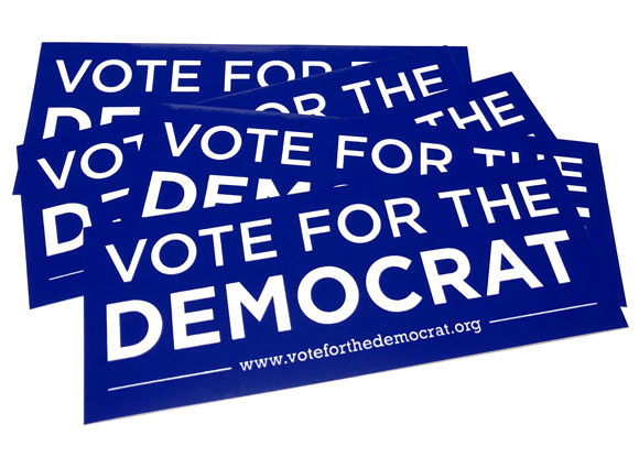 a pile of five blue stickers reading "Vote for the Democrat"